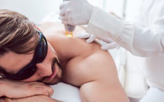 Man in a hair removal studio